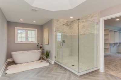Open Shower with Frameless Glass and Stone Flooring